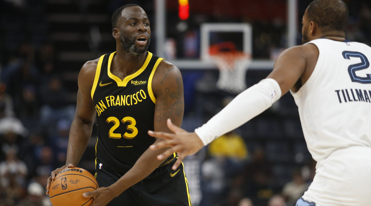 Golden State Warriors forward Draymond Green handles the ball against the Memphis Grizzlies.